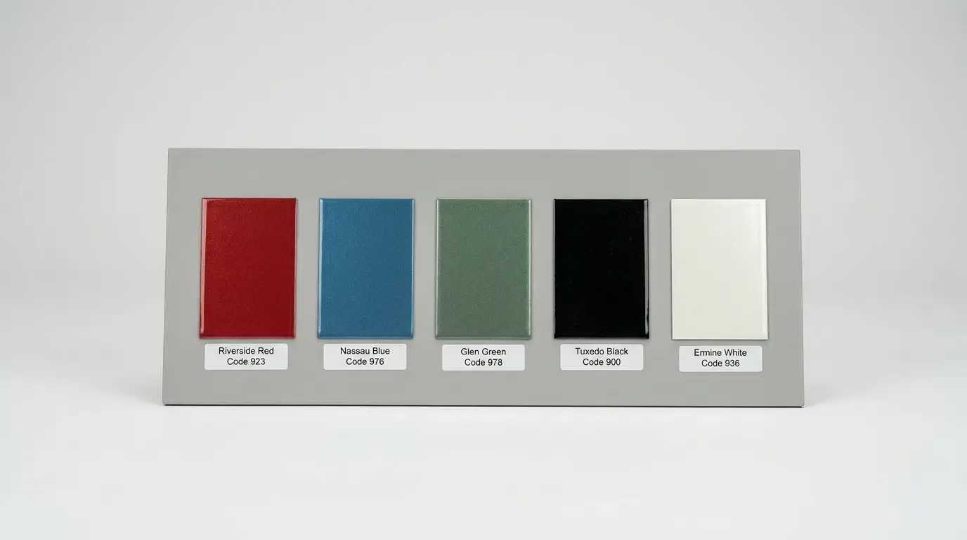 Factory paint color swatch display showing 1963-1967 C2 Corvette exterior colors including Riverside Red, Nassau Blue, Glen Green, Tuxedo Black, and Ermine White with factory paint code labels
