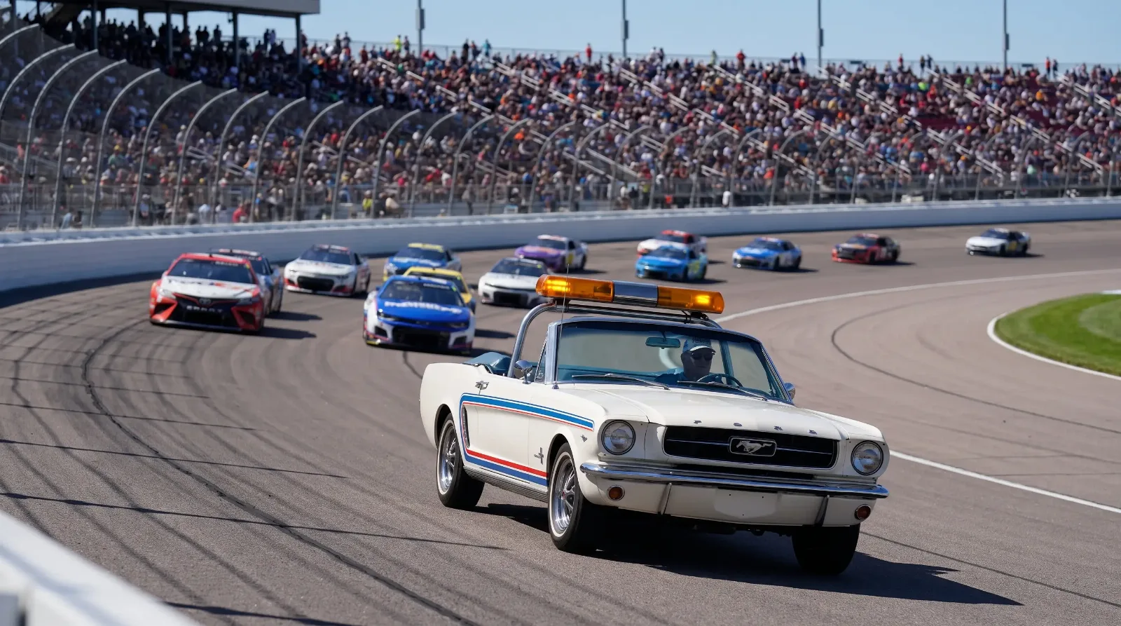 Classic Ford Mustang convertible pace car on a speedway