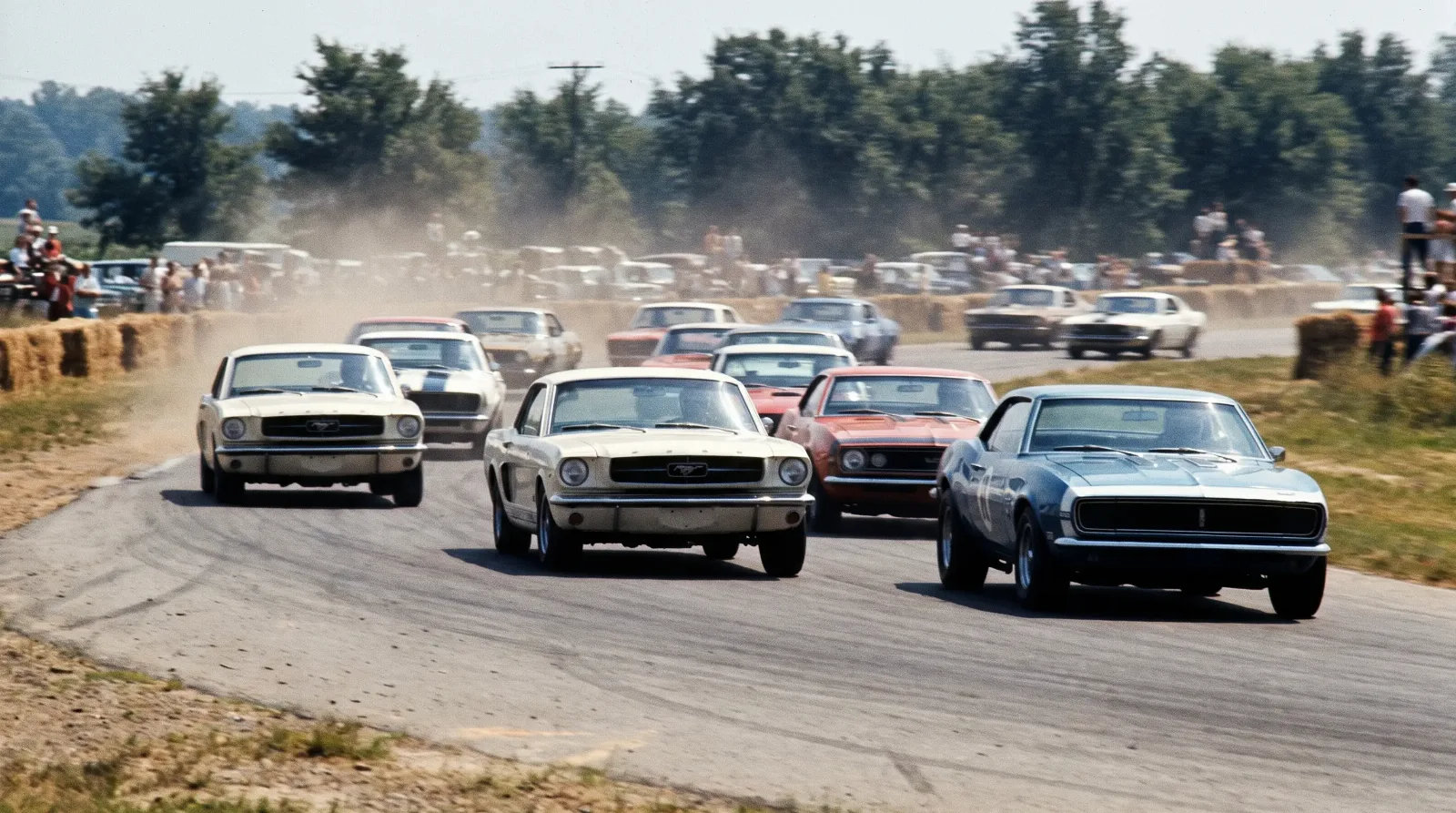 Vintage Trans-Am pony cars racing mid-corner